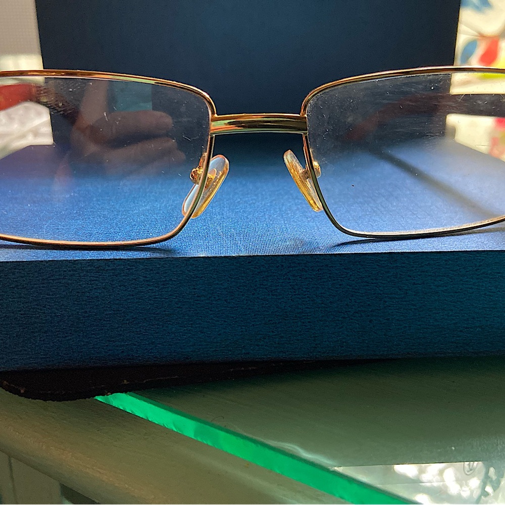 CARTIER GLASSES.  WOOD SIDES.  YOU MAY WANT TO REPLACE LENSES